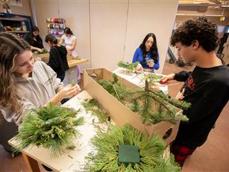 students arranging flowers in floral design class