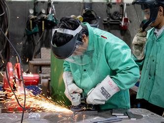 student welding in high school welding program