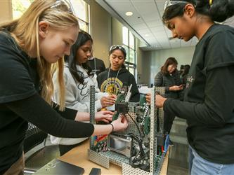 Solano Robotics students at final competition students building robots