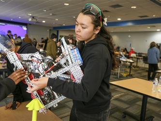 Solano Robotics students at final competition students building robots