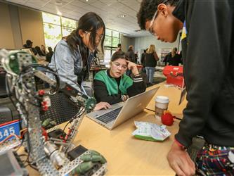 Solano Robotics students at final competition students building robots