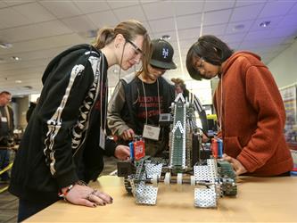 Solano Robotics students at final competition students building robots